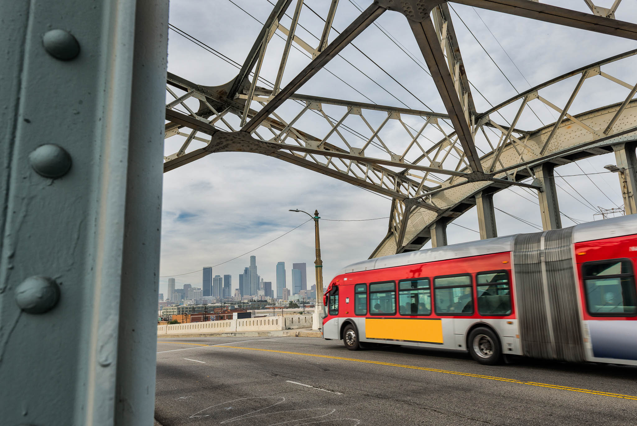 Bus moving across the 6th street bridge in LA.