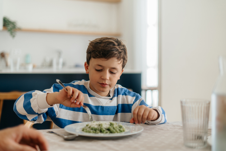 Boy eating at home