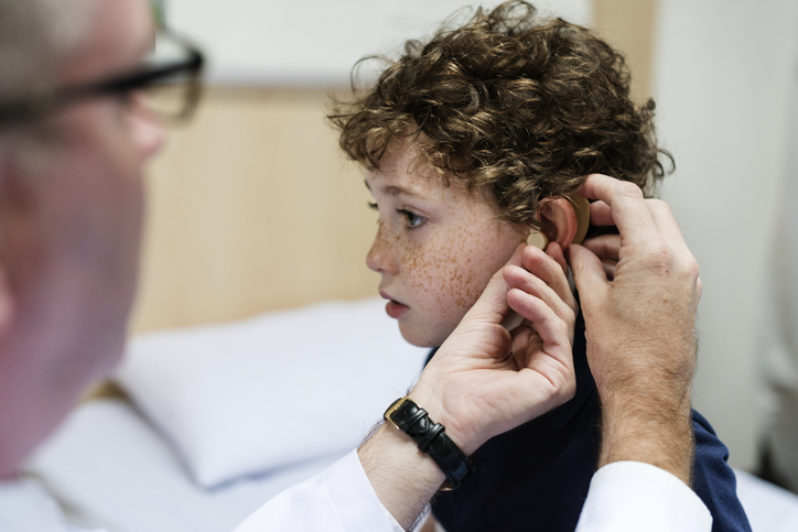 Young boy having his ears checked