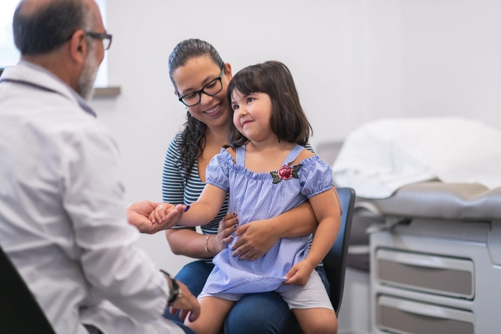 Mother with elementary age daughter in medical appointment